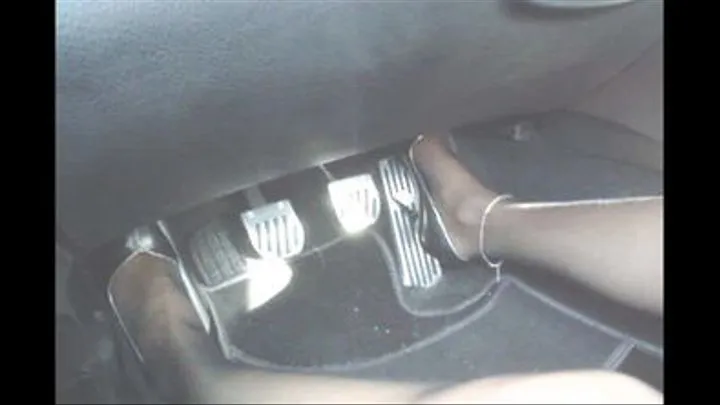 driving in her 5inch metal-spike high heels