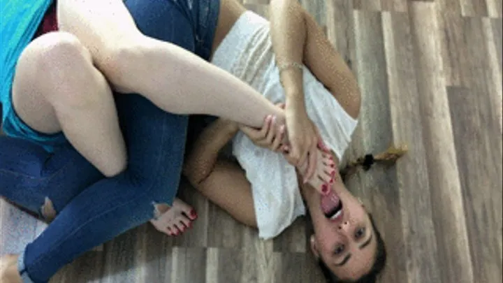 2 Women Lie On The Floor And Lick Feet