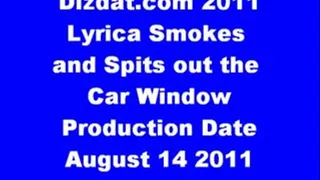 Lyrica smokes and spits out the car window