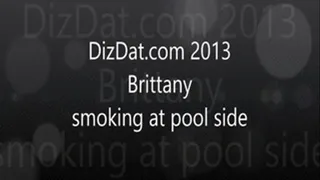 Brittany smoking at pool side