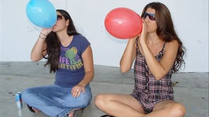 two girl out door balloon blow to pop