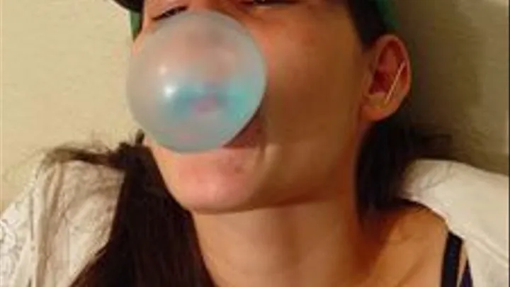 Summer Bubble gum blowing in her ball cap