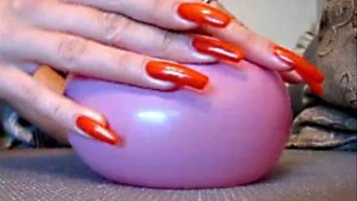 Sharp nails are playing with a puny balloon