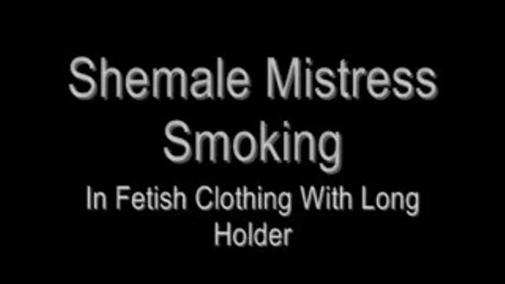 Shemale Mistress Smokes In Fetish Clothing