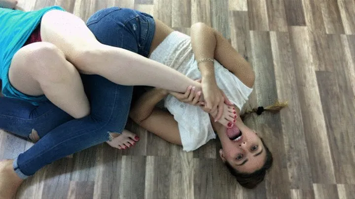 2 Women Lie On The Floor And Lick Feet