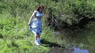 Playing in the mud in a pin-up dress