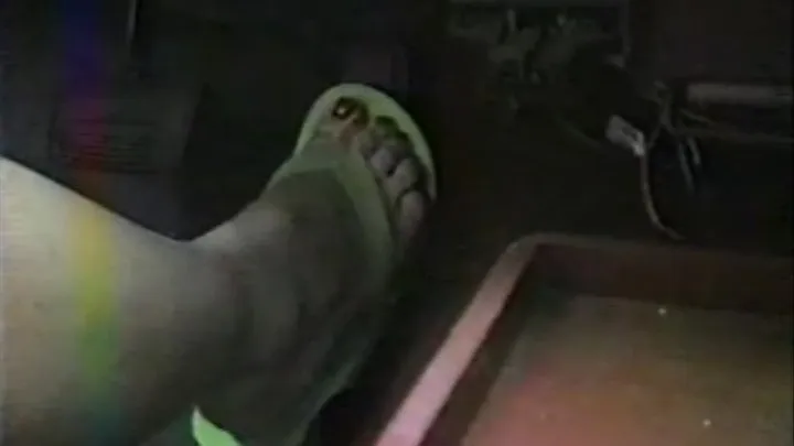 candi in green flip-flops