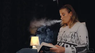 Anette reading and smoking