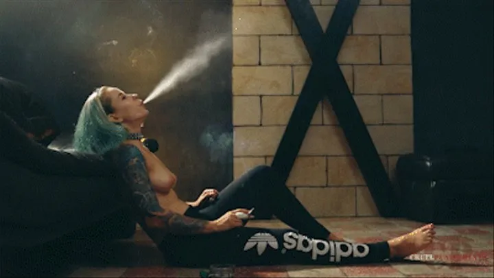 Topless Anette smokes on the floor