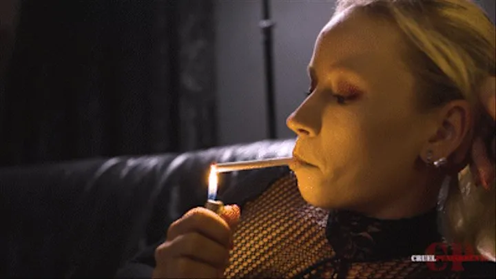 Anette smokes in fishnet