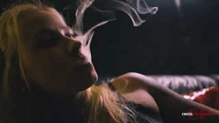 Her face covered in smoke