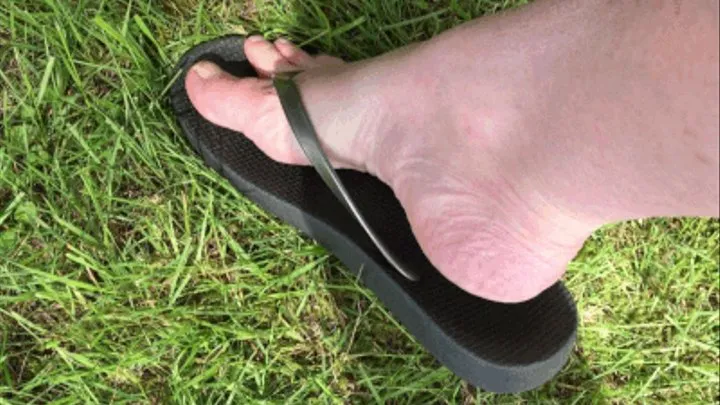 Bare foot in flipflops