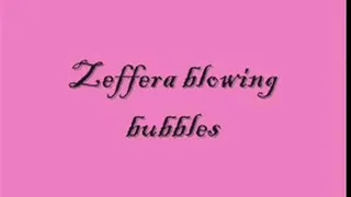 Zeffera blowing bubbles