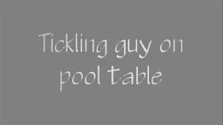 Tickling guy on pool table