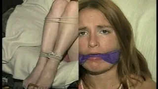 24 Yr OLD CRAFTER IS BLINDFOLDED, CLEAVE GAGGED WITH WRAP AROUND VET TAPE, BALL-TIED,CROTCH ROPED, BAREFOOT, TOE-TIED, GAG TALKING THROUGH A WET DROOL GAG, HOPS AROUND WEARING A SEXY BIKINI