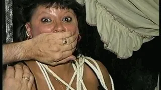 33 YEAR OLD AMERICAN INDIAN IS HANDCUFFED, MOUTH STUFFED, CLEAVE GAGGED, CHAIR TIED, BALL-GAGGED, HANDGAGGED WEARING LINGERIE, GARTER BELT, NYLONS & HEELS