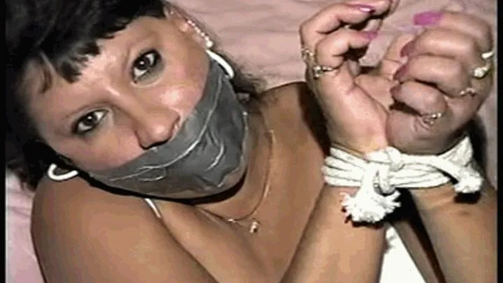 33 YEAR OLD AMERICAN INDIAN TRISH IS MOUTH STUFFED, DUCT TAPE GAGGED, BAREFOOT, & TIED UP TIGHT WITH ROPE