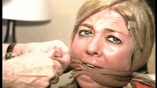 42 YEAR OLD MODEL IS UN-WRAPPED BONDAGE TAPE GAGGED, MOUTH STUFFED, HANDGAGGED, GAGGED WITH HER STINKY SWEATY PANTYHOSE