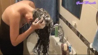 Washing hair in the sink.