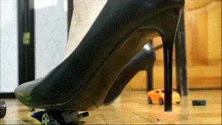 Crush toy cars in black high heels