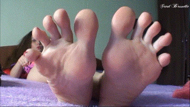 Her lovely long feet with a thumb.