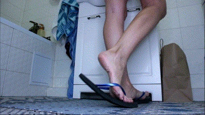 Black flip flops in bathroom