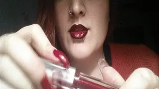 Messy lipgloss: black lined lips and red lipgloss