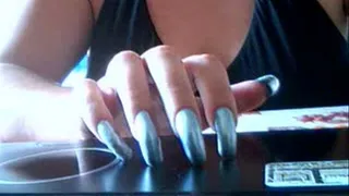Long silver nails tapping