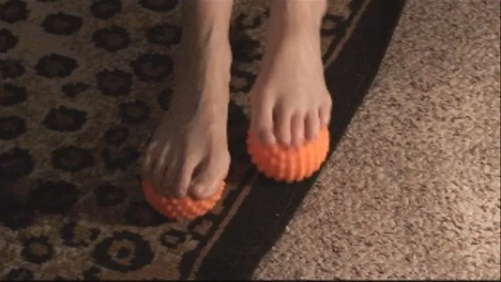 Tiffani Massages Her Feet With Orange Balls