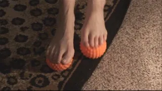 Tiffani Massages Her Feet With Orange Balls