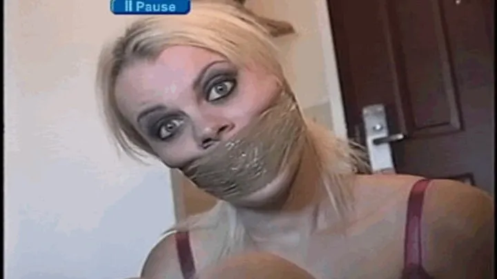 SEXY AND CUTE BLONDE MODEL IS BALL-TIED AND WRAP TAPE GAGGED WITH PACKAGING TAPE, TOE-TIED, GAG TALKING, MOUTH STUFFED, HANDGAGGED AND TO SMELL WET RAG THAT WAS IN HER MOUTH