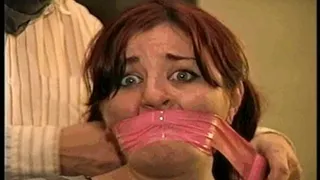 23 YR OLD REAL ESTATE BROKER IS MOUTH STUFFED, CLEAVE GAGGED, GAG TALKS, HANDGAGGED, WRAP TAPE BONDAGE TAPE GAGGED, BAREFOOT AND TIED TO A CHAIR WITH ROPE