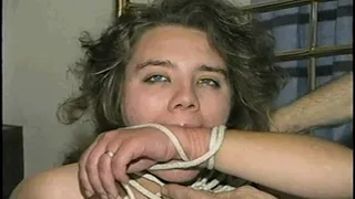 25 YEAR OLD STRIPPER/DANCER IS BOUND NAKED, BALL-GAGGED, CROTCH ROPED & HANDCUFFS & GAGS HERSELF