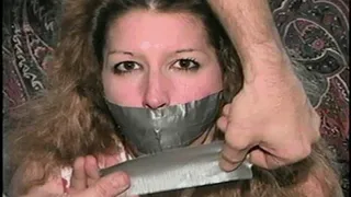 BALL-TIED, MOUTH STUFFED, TAPE GAGGED, UP SKIRT HOSTAGE