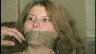 ONE SEXY TAPE BOUND, WRAP TAPE & BALL-GAGGED HOSTAGE