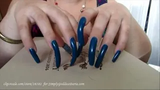 Blue Nails Tapping On Burberry Box