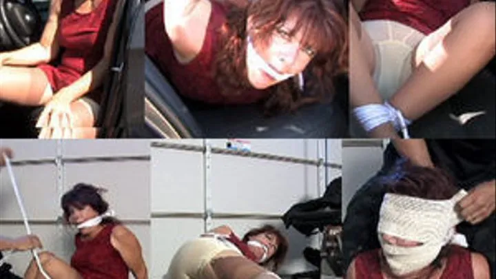 Carjacked MILF gets tied up and gagged in the back seat of her car.