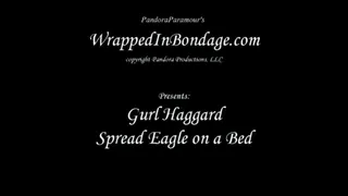 Gurl Haggard spread Eagle on a bed