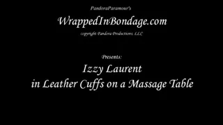 Izzy Laurent in Leather Cuffs on a Massage Table for