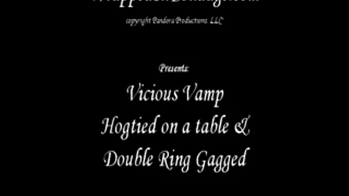 Vicious Vamp Hogtied on a Table & Double Ring Gagged