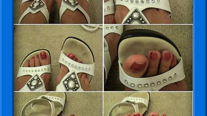 Sexy red painted toes in and out of white sandals