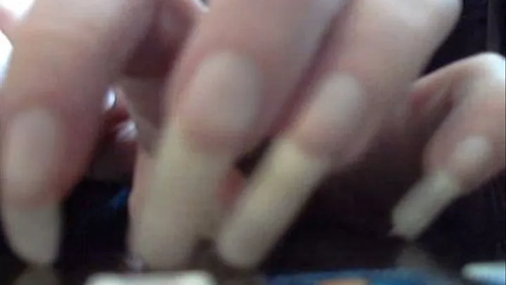 Very Long Natural Nails close up and tapping