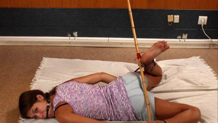 Roxana barefoot tied with a stick and ball-gagged