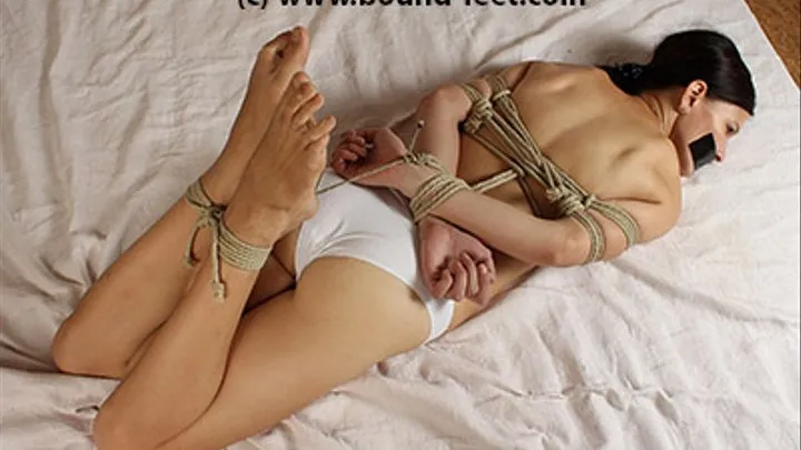 Juanita topless hogtied barefoot, tapegagged, trying to get free