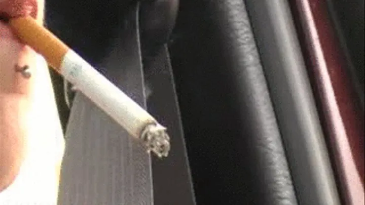 Dangling a Cigarette and driving a car