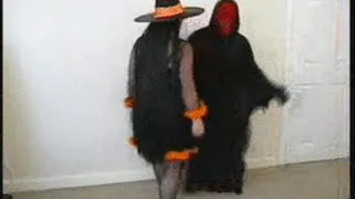 Witch slaps the demon's crotch