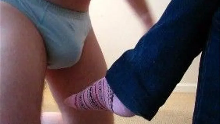 Flicking his balls with her sock