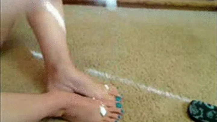 Massaging and Rubbing lotion into my feet blue toe nails for pocket pc