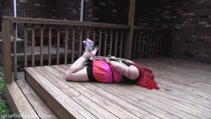 Sammi hogtied outside on deck