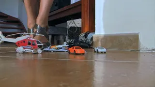 Brown ZARA classic sandals on metal heels crushed helicopter and three small toy cars (View from the second camera)